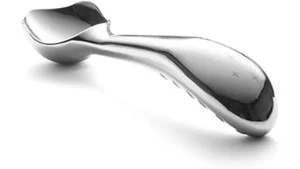 The image shows several shiny metal ice cream scoops arranged neatly, ready for serving.