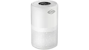 The image shows a clean, modern living space with several sleek air purifiers displayed.