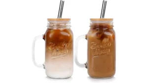 The image shows several mason jars filled with iced coffee, showcasing popular choices for the season.