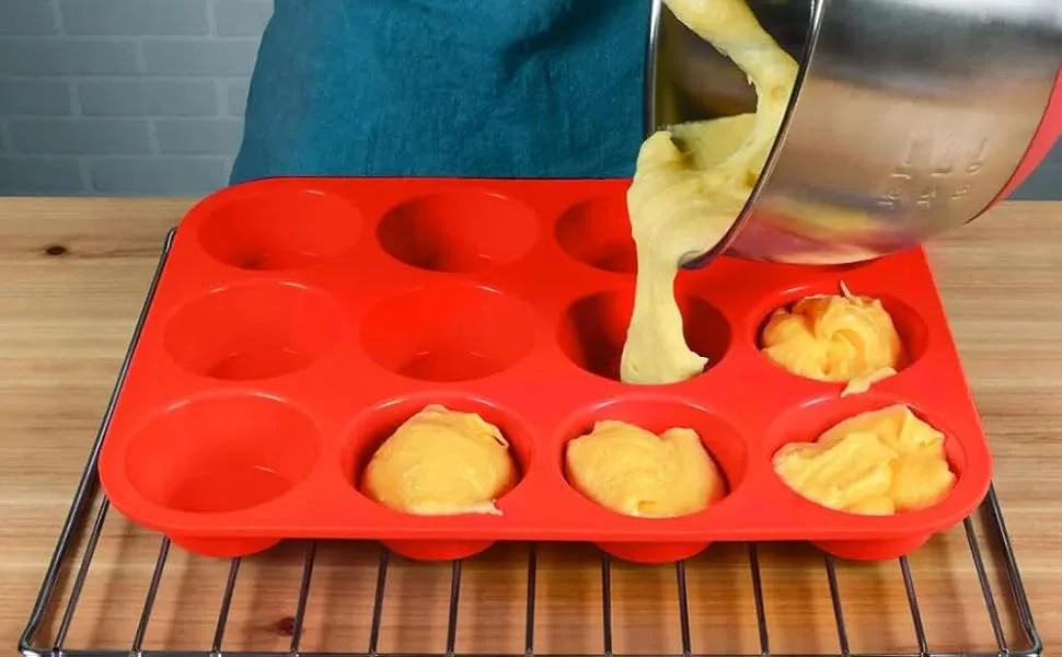 filled muffin batter in silicone pan